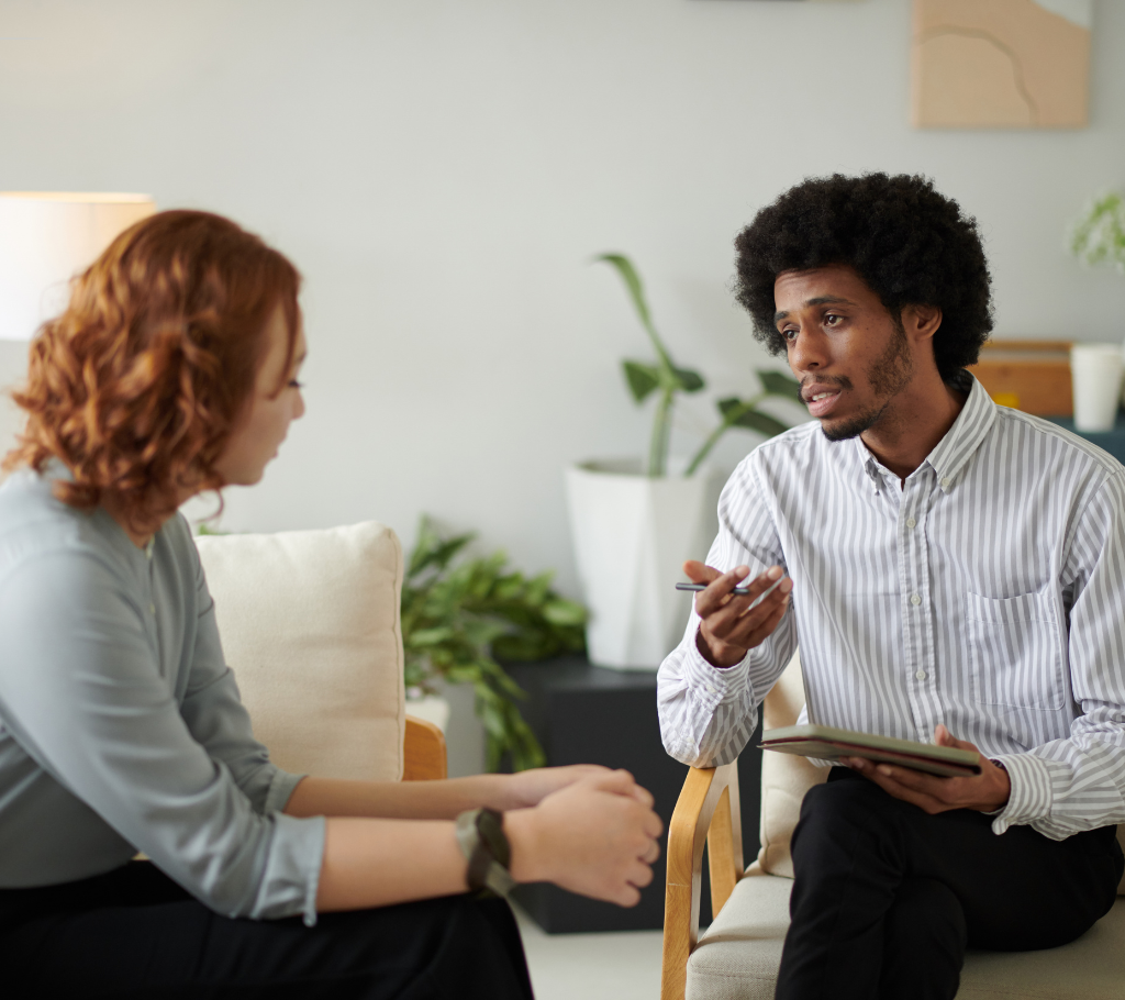 Therapist speaking with a client during a counseling session